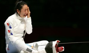 Women's Epeeist, Shin Lam of Korea, after her controversial defeat in the 2012 Olympics. Photo from TheGaurdian.com